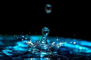 water droplet hitting pool of water